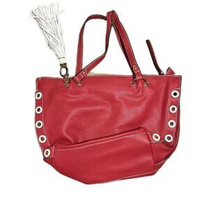 Sondra   Roberts squared red bag with white tassel. Super cute.